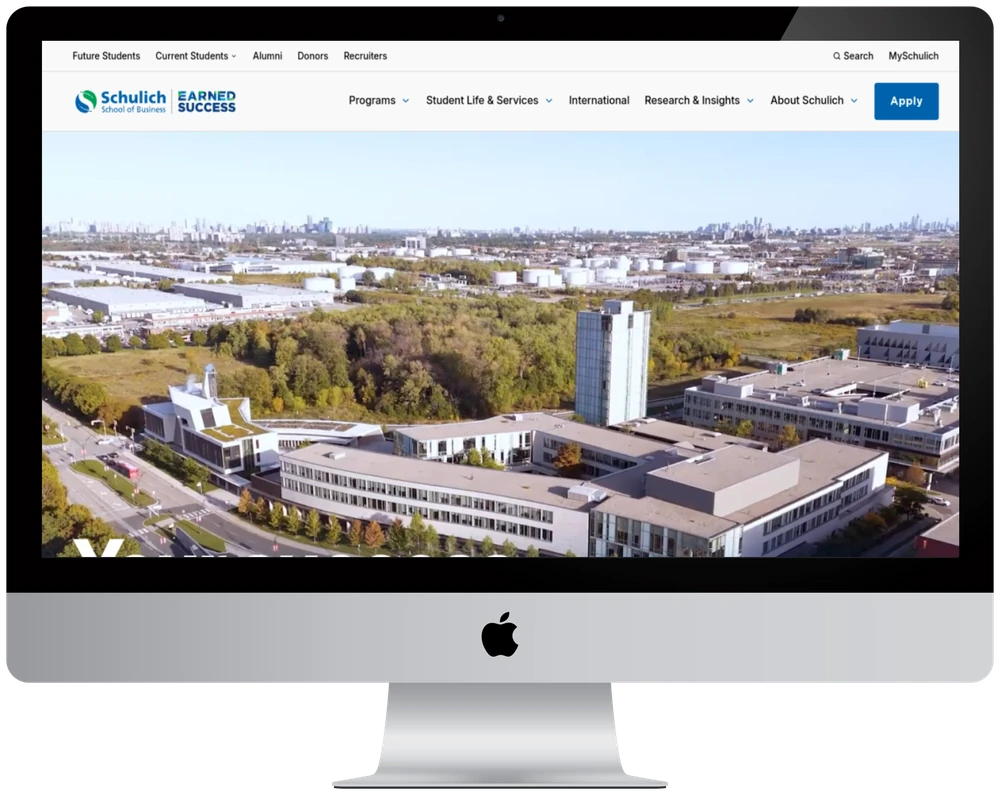 Schulich School of Business website shown on a desktop monitor